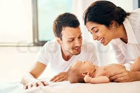 New parents learning baby care together.