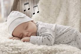 Baby sleeping soundly with lullaby music in background.