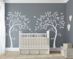 Stenciled wall decor and soft lighting in nursery