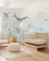 Nursery walls with non-toxic paint and removable wallpaper samples