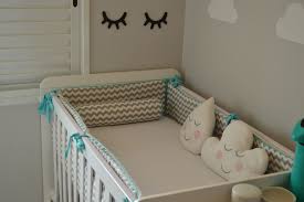 Baby-safe nursery setup with crib and safety bumpers