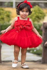 Baby dressed in special occasion clothing with headband