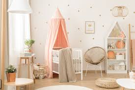 Nursery room with comfy recliner and baby crib
